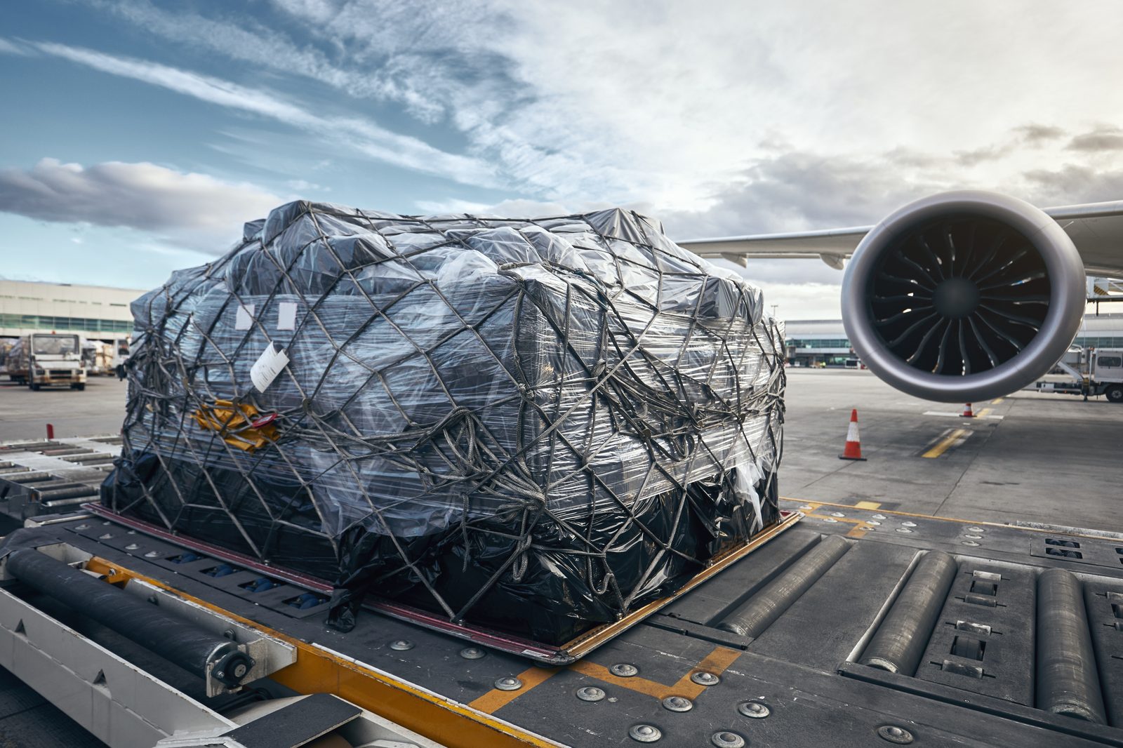 Palletised air cargo being loaded onto a freight aircraft